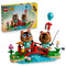 LEGO Animal Crossing Timmy & Tommy's Fun Day Out 77059 pairs the yellow retail box with two brown figures, a red bridge, blue stream, flowers, fishing rod, and balloon gift.