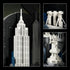 LEGO Architecture New York City landmark details show white plastic brick models of the Empire State Building, Brooklyn Bridge and Statue of Liberty on black panels.