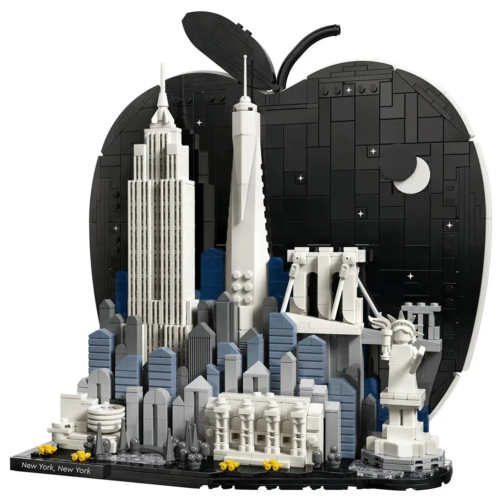 LEGO Architecture New York City model uses black, white, gray and blue plastic bricks to form an apple-shaped skyline with landmark buildings on a white background.
