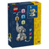 LEGO baby elephant display packaging showing navy and yellow cardboard panels, gray elephant model with interchangeable balloon colors and decorative accent options on a starry studio background.