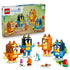 LEGO Bluey Brick-Built Family 11217 pairs the retail box with four blue, orange, brown, and yellow character models and colorful play accessories on a white background.
