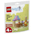LEGO Bluey restaurant playset in cream, brown, pink and light blue plastic bricks, shaped as a small café counter with food accessories and Bingo character chef, shown on retail pouch artwork.