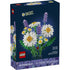 LEGO Botanicals Daisies box front with dark blue packaging showing white daisy blooms with yellow centers and lavender sprigs, detailed plastic brick botanical model for decorative display.