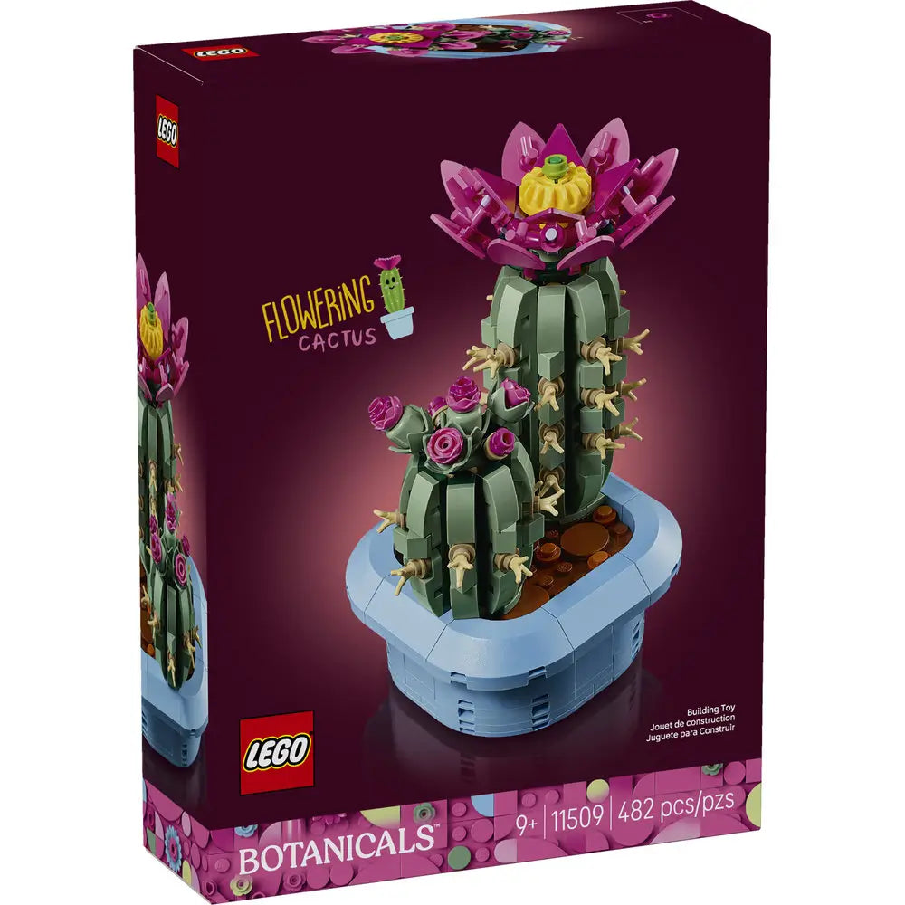LEGO Botanicals Flowering Cactus box front with deep purple packaging showing green cactus build with vivid pink flower, detailed plastic brick botanical model for decorative display, photographed against a dark studio background.