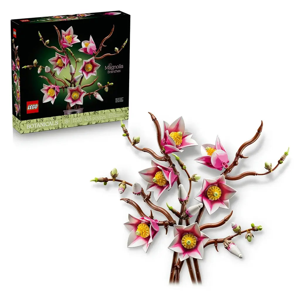 LEGO magnolia branches set includes pink and white plastic flowers with yellow centers on brown stems, styled as decorative floral home decor, shown alongside branded packaging on a clean background.