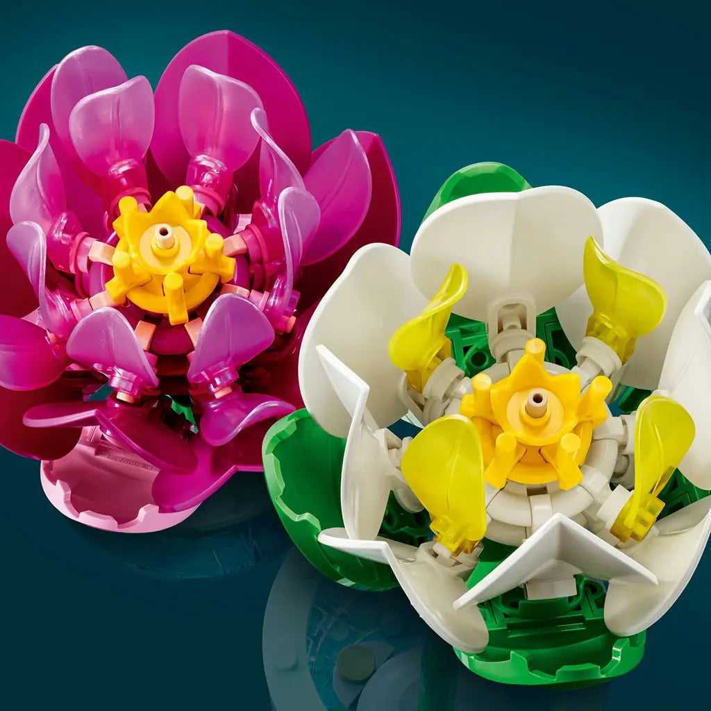 LEGO Botanicals Water Lilies feature glossy pink, purple, white, yellow, and green plastic layered petals with detailed yellow centers against a dark teal background.