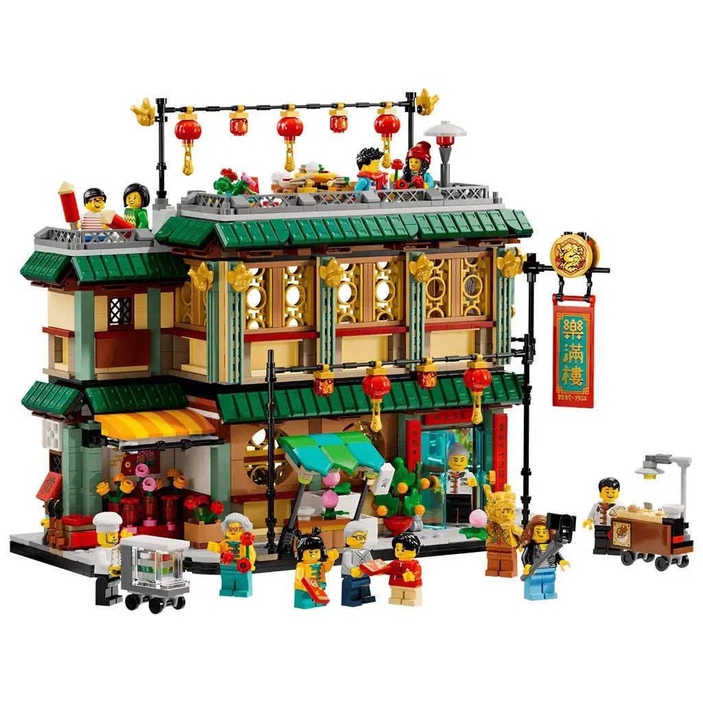LEGO Spring Festival 80113 set in green, red, gold and tan plastic shows the Family Reunion Celebration restaurant with lanterns, minifigures and food carts on white.