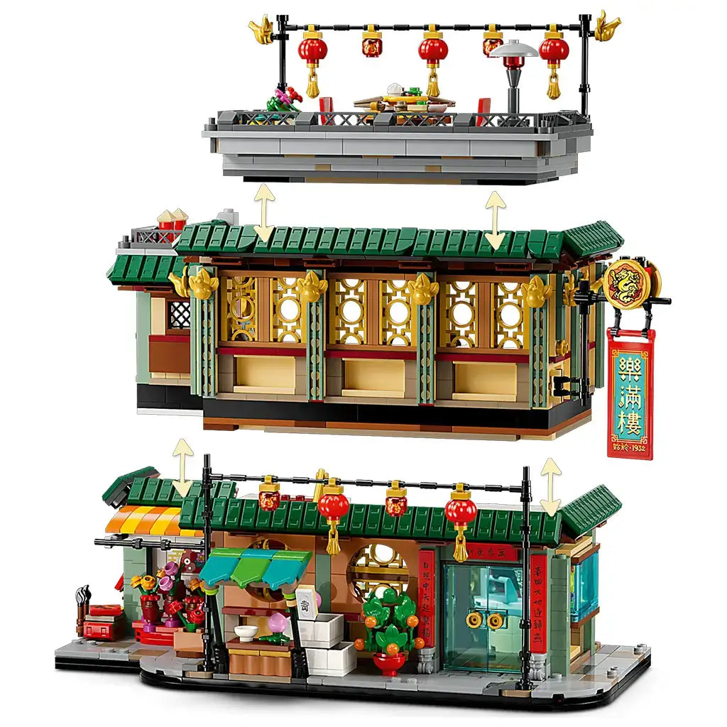 LEGO Spring Festival restaurant in green, red, gold and tan plastic is shown in three removable modular levels with lanterns, dining areas and storefront on white.