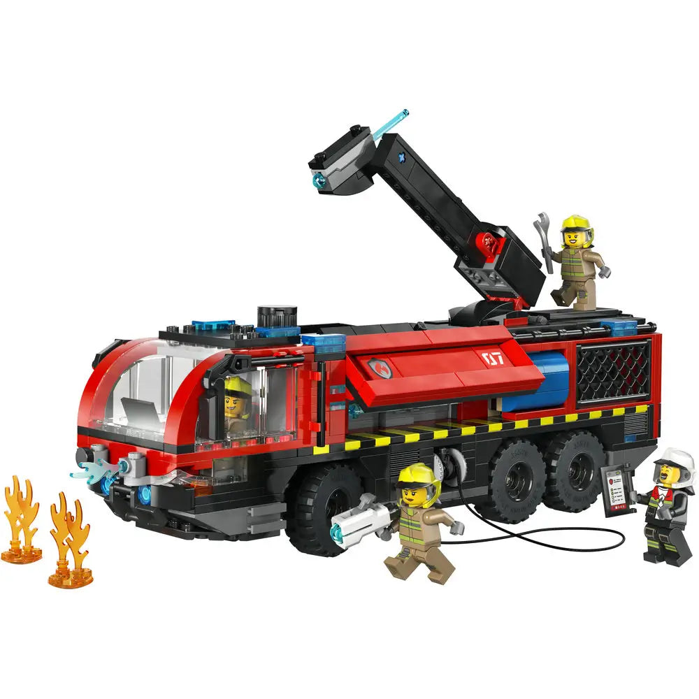 LEGO City airport fire truck playset featuring a red and black plastic fire engine with six rolling wheels, an extendable water cannon arm, firefighter minifigures, and flame elements for rescue play.