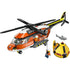 LEGO City Coast Guard Helicopter rescue set featuring an orange, white, and yellow plastic helicopter with spinning rotors, rescue winch, lifeboat pod, shark figure, and minifigures on a clean white background.
