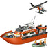 LEGO City Coast Guard Rescue Boat set featuring an orange and white plastic patrol ship with radar deck, helicopter, rescue dinghy, and minifigures, designed for maritime emergency play on a clean white background.