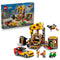LEGO City Pizza Delivery Experience set 60496 in yellow, brown, red, and green plastic bricks includes a pizza shop, sports car, green scooter, delivery drone, and minifigures.