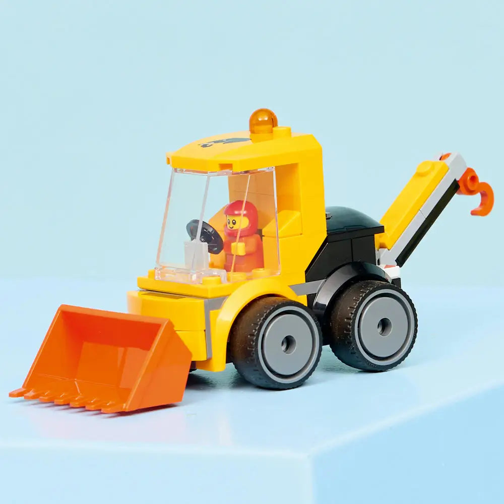 LEGO City Loader fully built display model in yellow and black plastic bricks, small articulated bucket, enclosed cab with clear panels, six wheels, and construction worker minifigure on a clean studio background.