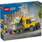 LEGO City delivery van box front showing blue branded packaging with a bright yellow plastic van, printed brick graphics, delivery minifigures, and a city street scene highlighting creative delivery roleplay.