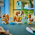 LEGO Creator 3-in-1 animal models displayed together on a tabletop, showing a brown and white puppy, a duck, and a squirrel made from smooth plastic bricks in a bright indoor room.