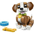 LEGO Creator puppy toy shown in brown and white plastic bricks with a smooth glossy texture, rounded ears, big eyes, and a green collar, posed upright on a plain white studio background.