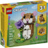 LEGO Creator Cute Hamster with a Flower box front showing a tan and white brick-built hamster holding a purple flower, featuring rounded shapes, glossy plastic texture, and illustrated outdoor scenery on bright yellow retail packaging.