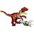 LEGO Creator fierce dinosaur built from red, dark red, and yellow plastic bricks with a smooth glossy texture, angular body shape, open jaw with pointed teeth, clawed legs, and long tail, displayed with a small nest accessory on a white background.