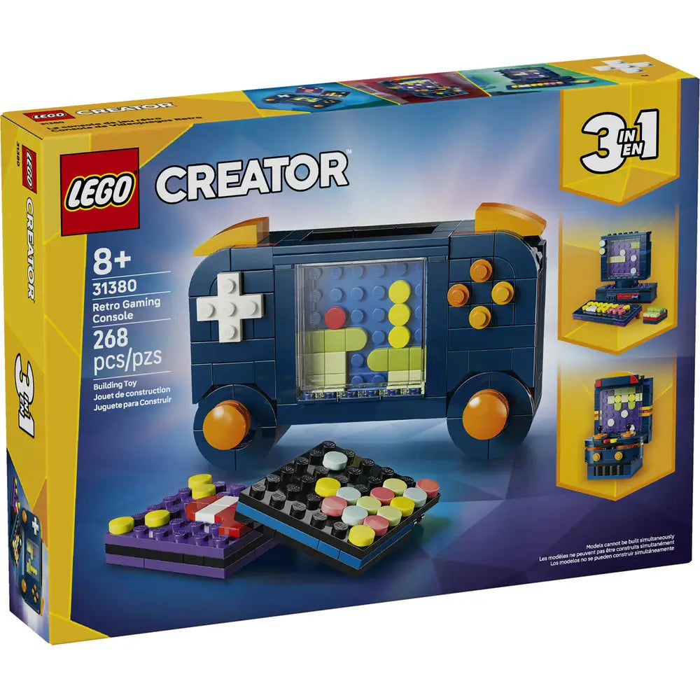LEGO Creator retro gaming console shown in dark blue plastic bricks with a smooth glossy texture, rounded rectangular shape, colorful screen tiles, control buttons, and handheld controllers, presented on bright yellow and blue retail packaging.