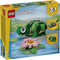 LEGO Creator Turtle with a Water Lily box front showing a green brick-built turtle with a rounded shell, smooth plastic texture, and pink flower accessory illustrated on bright yellow retail packaging.