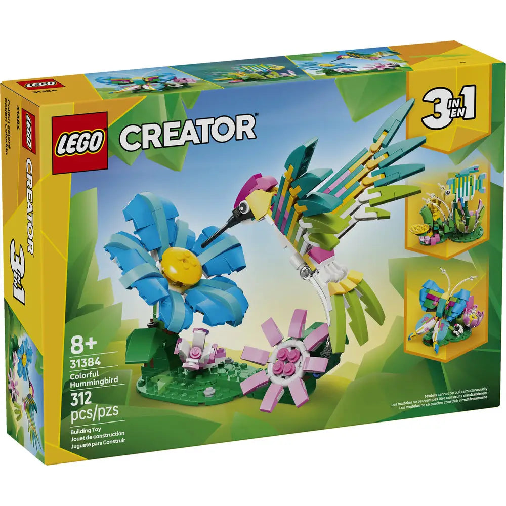 LEGO Creator box front for Colorful Hummingbird shows a multicolored hummingbird feeding from a blue flower on a leafy green base, highlighting 3 in 1 builds, set 31384, 312 pieces, and age 8+ label.