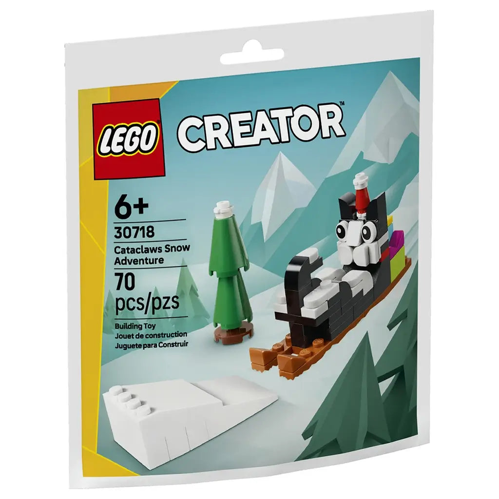 LEGO Creator Cataclaws Snow Adventure building set in black, white, green and brown plastic brick form, shaped as a playful cat riding a sled through a snowy mountain scene on retail pouch packaging.