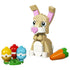LEGO Creator Cute Easter Bunny toy display showing tan and white plastic bricks, smooth rounded bunny shape with tall pink-lined ears, large printed eyes, heart-shaped pink nose, colorful Easter eggs, and carrot accessory on white background.