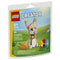 LEGO Creator Cute Easter Bunny building set package front showing pastel green and blue spring artwork, glossy cardboard pack, tan bunny model with pink ears and heart nose, colorful eggs, carrot accessory, age 6+ label, and 66-piece count.