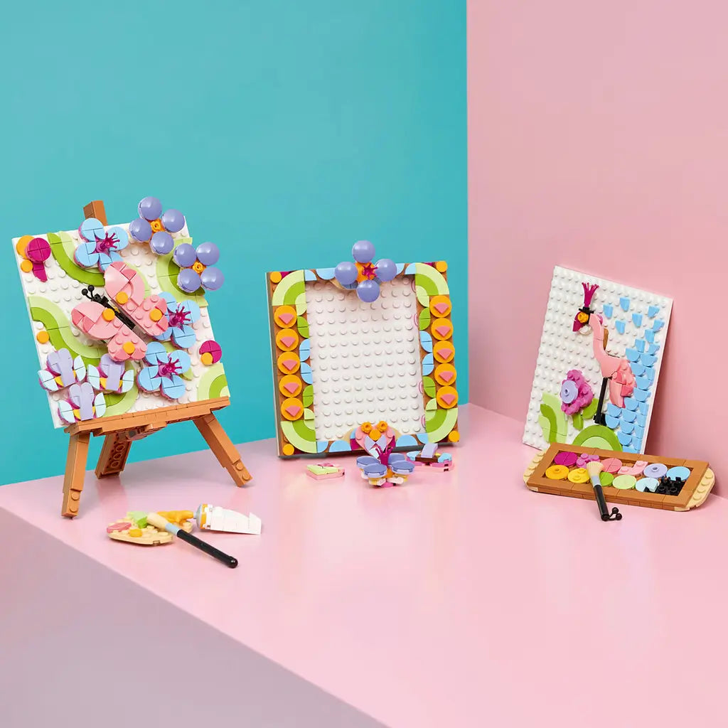 LEGO Creator Floral Art 3-in-1 builds in pink, blue, green and purple plastic, displaying a butterfly flower painting, floral frame and bird artwork on a pastel shelf.
