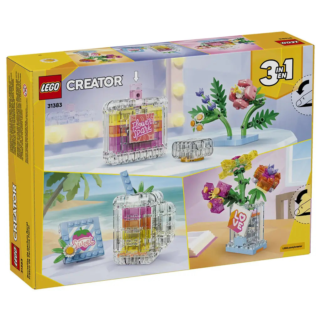 LEGO Creator 3-in-1 set 31383 box back in yellow and pink shows clear plastic brick builds for a floral perfume bottle, compact, picture frame, and flower vase.