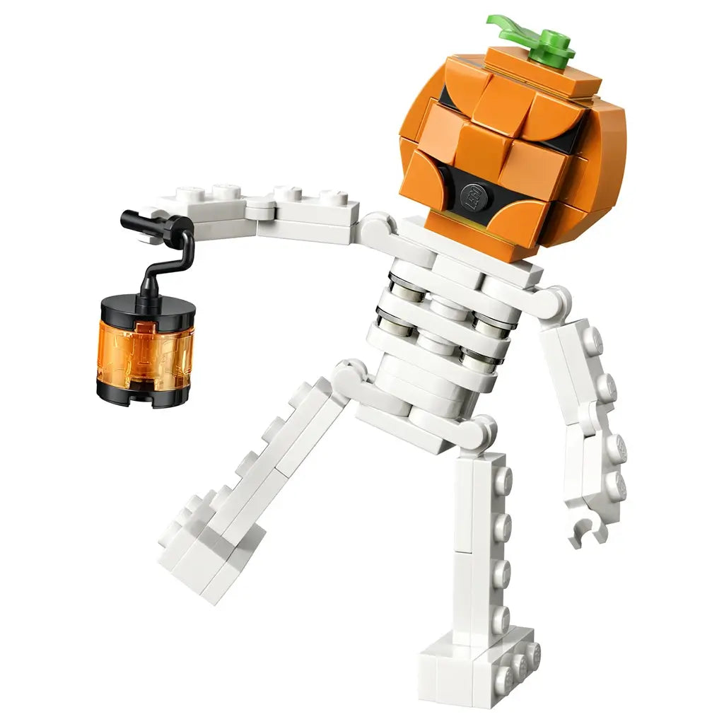 LEGO Creator Halloween skeleton toy in orange, white, black and translucent amber plastic bricks, shaped as a pumpkin-headed figure holding a lantern, isolated on a clean studio background.