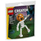 LEGO Creator Halloween skeleton building set in orange, white, black and green plastic bricks, shaped as a pumpkin-headed skeleton holding a lantern, displayed on festive retail pouch artwork with a spooky night backdrop.