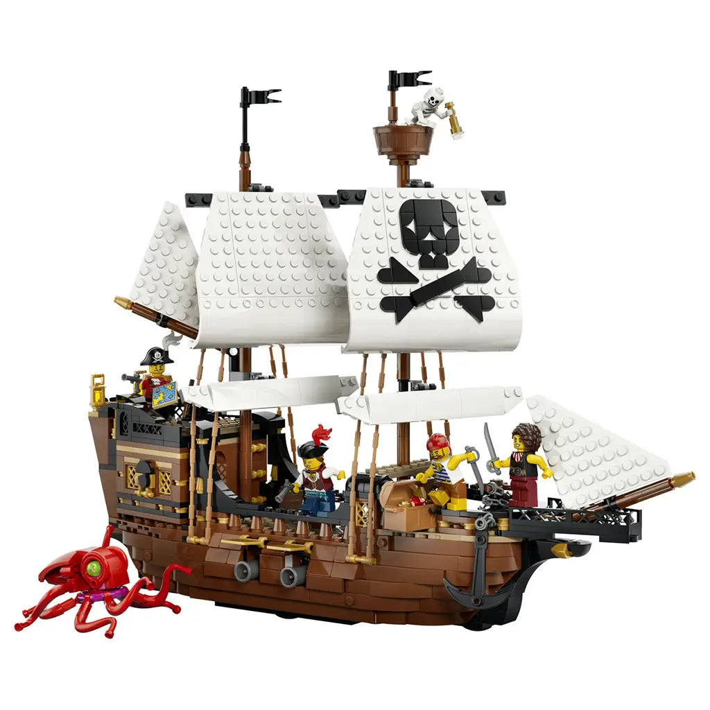 LEGO Creator Iconic Pirate Ship 31387 in brown, white and black plastic, featuring large white sails, a skull emblem, pirate minifigures and red sea monster on white.