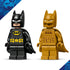 LEGO Batman minifigures in black and gold plastic, small articulated character figures with capes and printed suits, collectible superhero toys displayed side by side on a plain background.