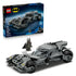 LEGO Batman Batmobile set in dark gray plastic, angular armored car shape with rugged tires and cockpit canopy, superhero vehicle toy displayed with box packaging on a clean studio background.
