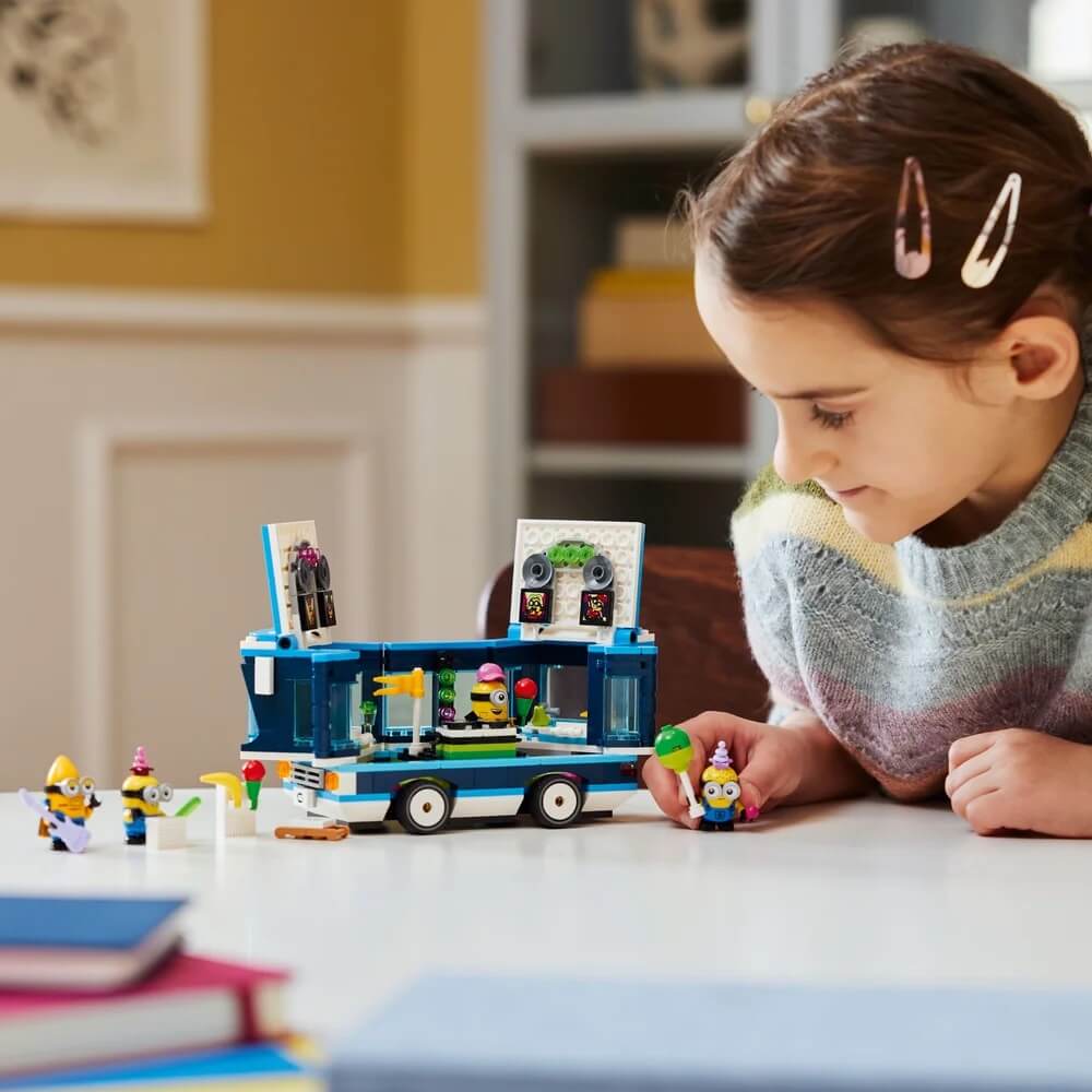 Another pic of girl playing LEGO® Despicable Me Minions' Music Party Bus 379 Piece Building Set (75581)