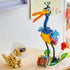 LEGO Disney Pixar Up Kevin and Dug display in multicolor plastic, tall bird with long legs and small dog with cone collar, finished model arranged on a wooden surface with soft home background.