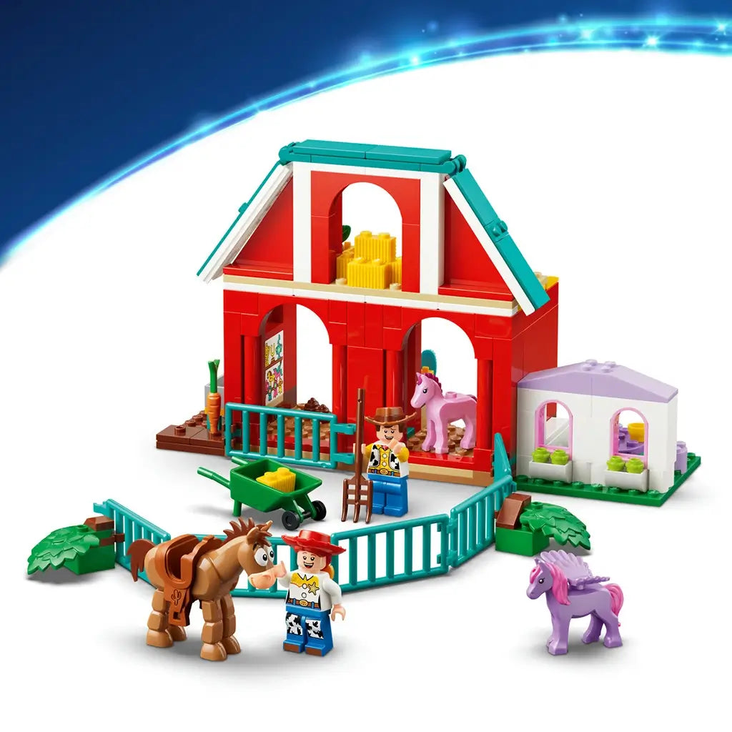 LEGO Disney Toy Story ranch playset features red, teal, green and lavender plastic pieces forming a barn, paddock and stable scene with horse figures on a light studio background.