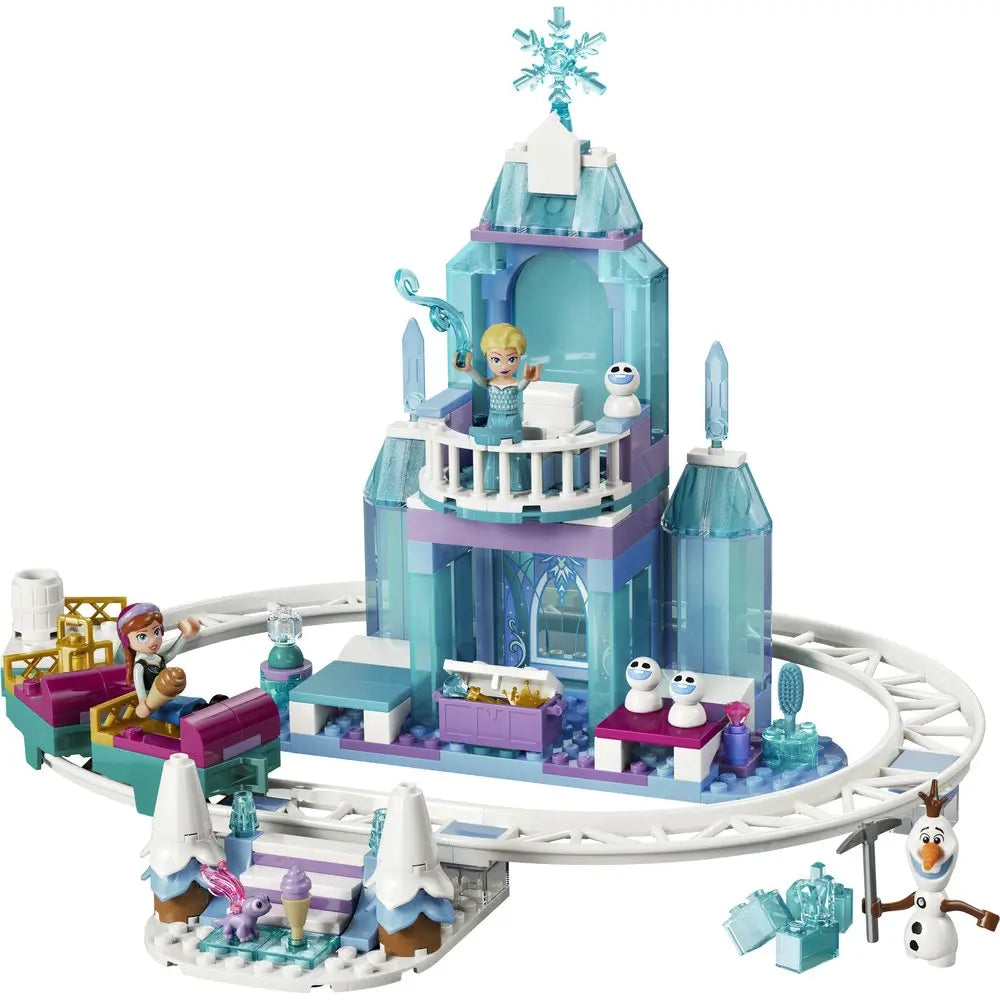 LEGO Disney Frozen ice castle toy built in icy blue and white plastic bricks, tall angular tower with balcony and snowflake topper, designed as Elsa’s Ice Castle playset with snow ride track on a clean white background.