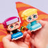 LEGO Disney Frozen Mini Anna and Elsa figures fully built and displayed, showing rounded mini-doll forms, vibrant blue and purple outfits, sunflower and ice accessories, and playful expressions on a clean surface.