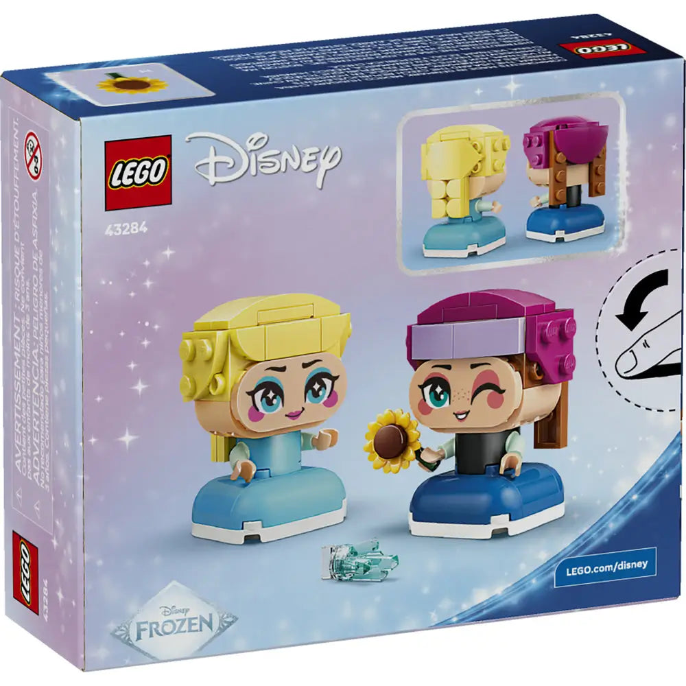 LEGO Disney Frozen Mini Anna and Elsa packaging back showing alternate poses, accessory play features, rotating display options, and illustrated building details against a light blue branded background.