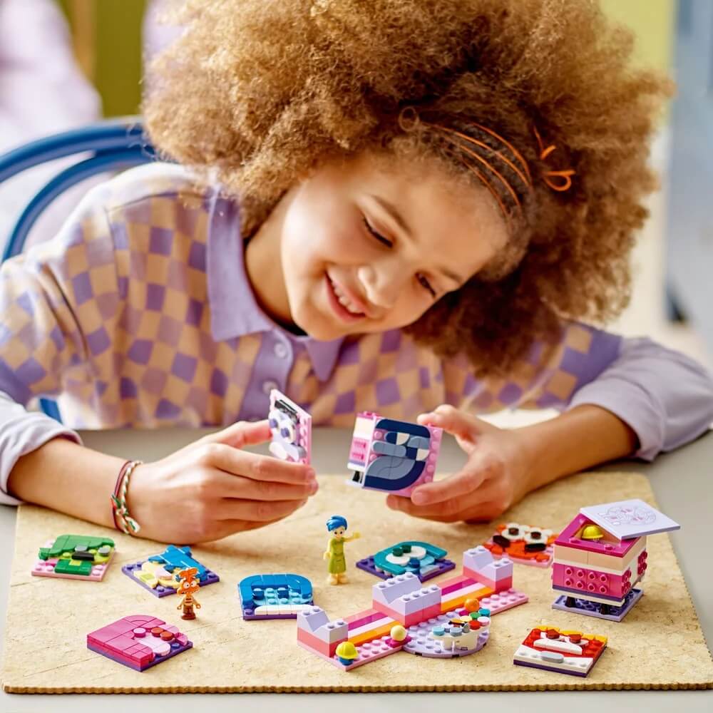 girl playing lego blox inside out mood cubes