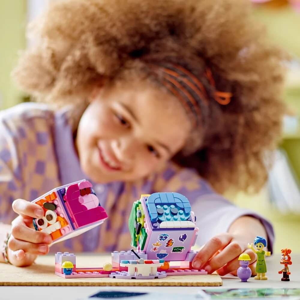 girl playing LEGO® Disney Pixar Inside Out 2 Mood Cubes 394 Piece Building Set (43248)