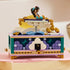 LEGO Disney Princess Jasmine's Jewelry Box in teal, lavender, white, and gold plastic is displayed on a pink book with Jasmine and Aladdin figures seated atop the palace scene.