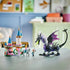 LEGO Disney Princess Maleficent's Dragon Form display with black and purple dragon, pink castle and character figures arranged on a tabletop in a bright indoor room.