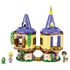 LEGO Disney Princess Rapunzel's Mini Tower in yellow, tan, purple, green, and gold plastic features two hinged round towers with flowers, Rapunzel, Flynn Rider, and Pascal figures.