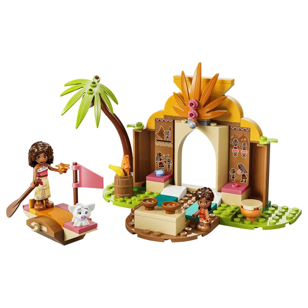LEGO Disney Moana Village House & Boat in tan, orange, green, and pink plastic features an arched tropical home, palm tree, canoe, two Moana figures, and pig.