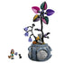LEGO Disney Sally flowerpot set features a blue plastic cauldron planter with engraved label, black twisting stems, purple bell flowers, and multicolor patterned petals, inspired by The Nightmare Before Christmas, displayed on a clean white background with figures.
