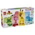 LEGO DUPLO Animal Building Game 10472 box shows colorful plastic frog, flamingo, giraffe and whale builds, plus loose bricks and accessories on a white background.