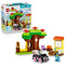 LEGO DUPLO Bluey Pizza Girls set 10469 includes colorful plastic tree, swing, house, campfire, pizza and car builds with Bluey and Muffin figures beside the box.